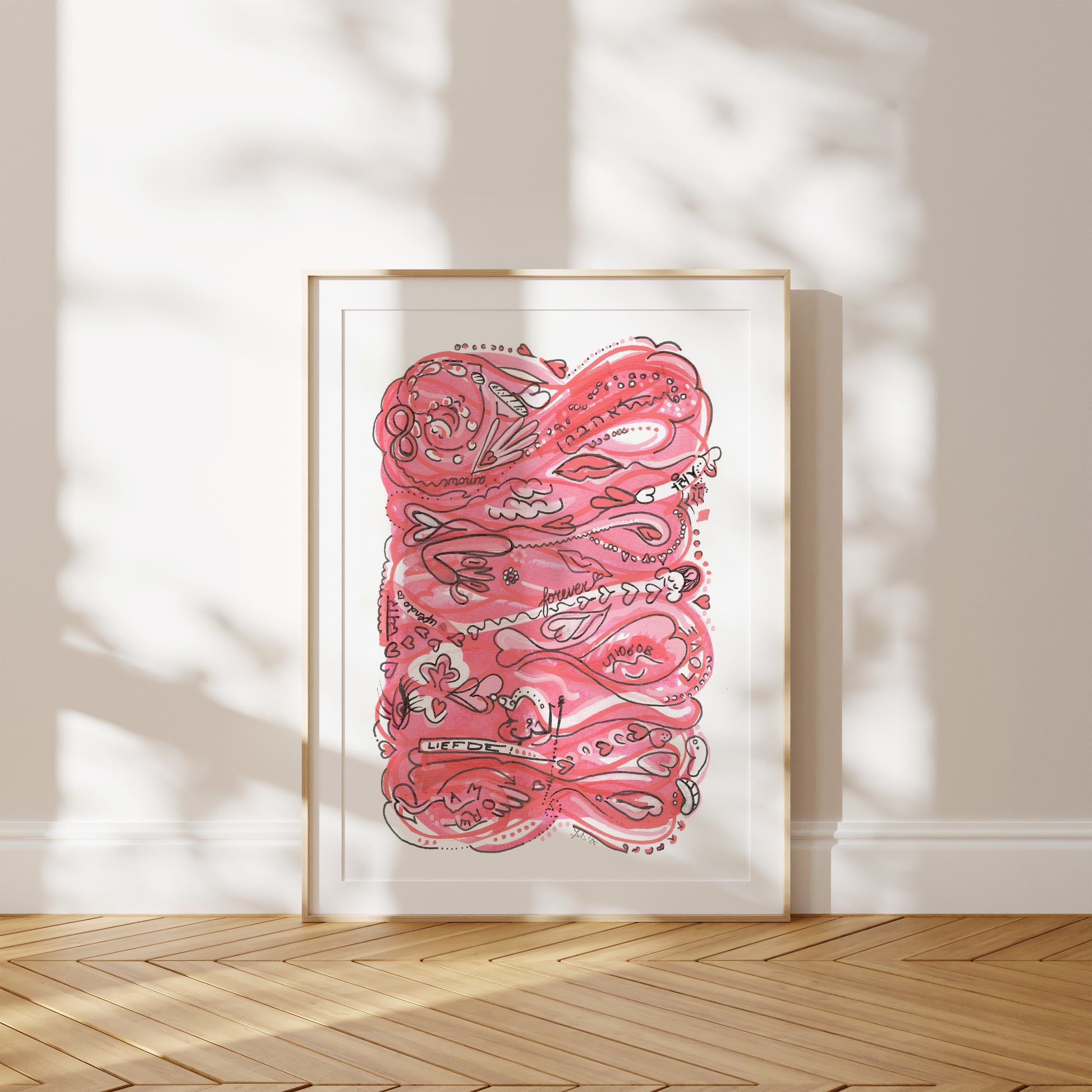 Framed pink and black abstract artwork on a white wall with wooden floor. A piece on Love and Empathy.